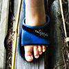 Slipper-clad feet exploring the backyard